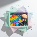 Sensory and fidget mystery gift box with calming tools for anxiety, ADHD, and autism for kids and adults